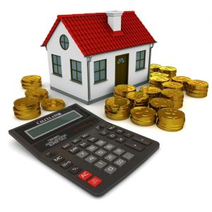 mini house with calculator and money